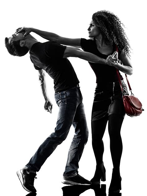 A woman wearing jeans and a handbag hits a man with the heel of her hand.